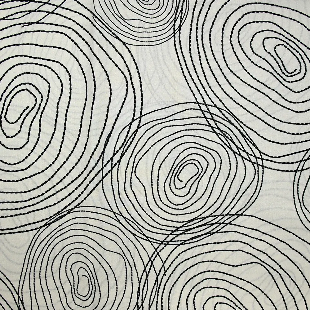 Popeline de coton imprimée escargot noir fond beige clair