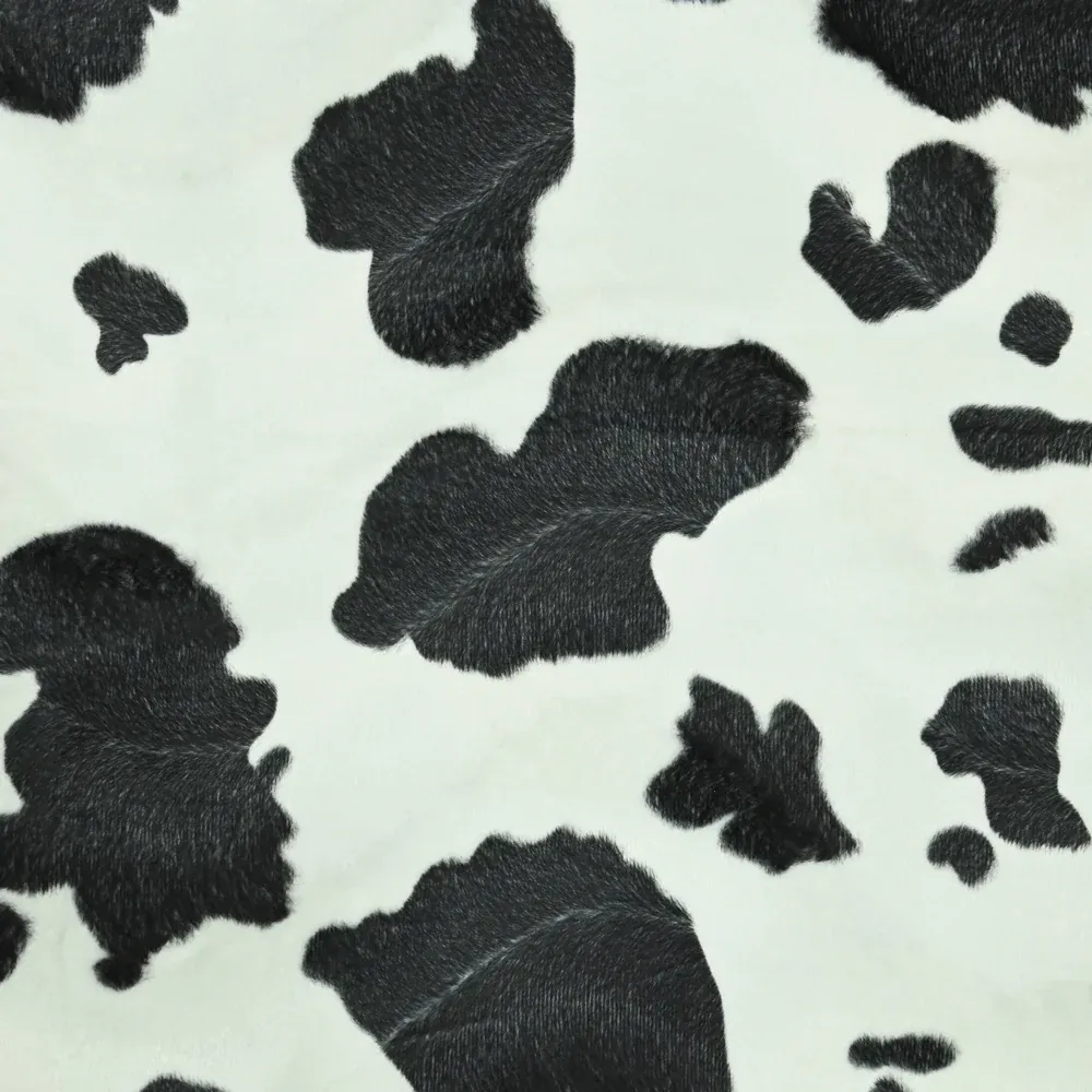 Fausse fourrure poils mi-longs vache noir